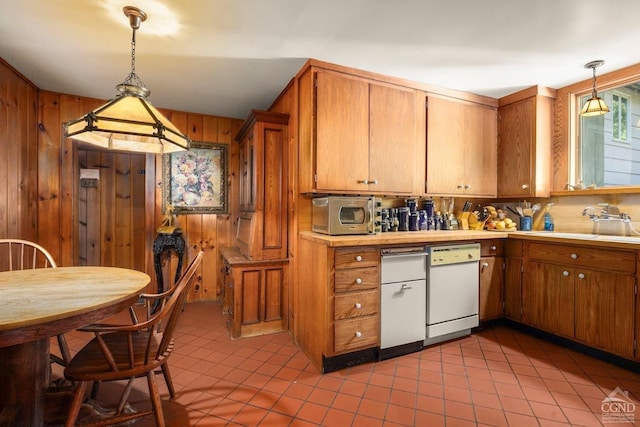 7951 State Route 22, Copake, NY 12516 - kitchen featuring white dishwasher, light tile patterned flooring, a sink, stainless steel microwave, and wood walls