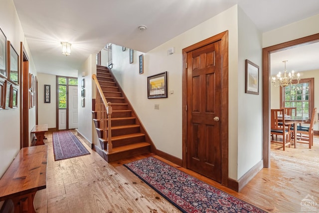 2205 County Route 5, Canaan, NY 12029 - foyer featuring a chandelier, hardwood / wood-style floors, stairs, and baseboards