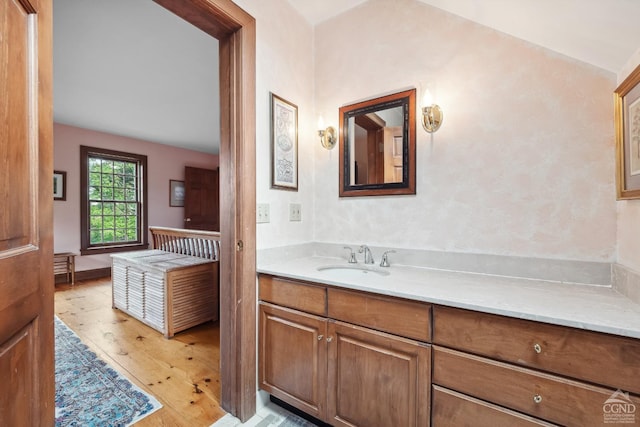 2205 County Route 5, Canaan, NY 12029 - bathroom featuring hardwood / wood-style flooring, vaulted ceiling, and vanity