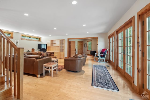 2205 County Route 5, Canaan, NY 12029 - living area with french doors, light wood finished floors, recessed lighting, and stairway
