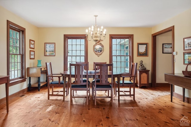2205 County Route 5, Canaan, NY 12029 - dining room with a chandelier, light wood-style flooring, and baseboards