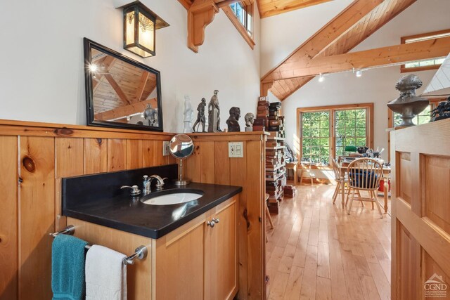 2205 County Route 5, Canaan, NY 12029 - bathroom with beam ceiling, hardwood / wood-style floors, high vaulted ceiling, and vanity
