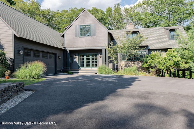 view of front of property featuring french doors and a garage