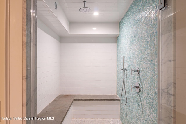 bathroom with tiled shower