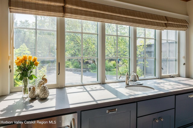 doorway to outside featuring wine cooler, sink, and a healthy amount of sunlight