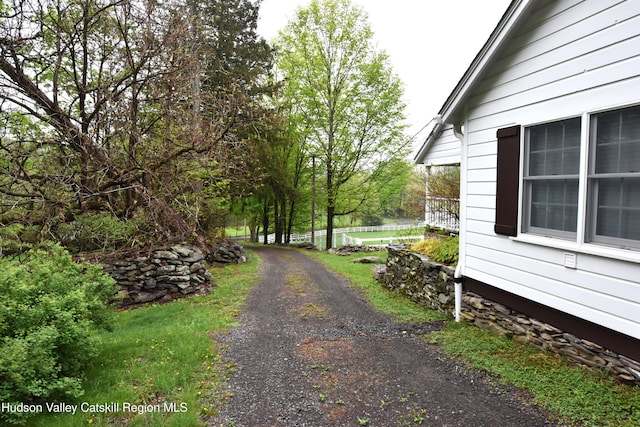 exterior space with gravel driveway