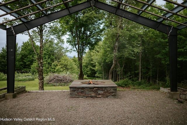 1199 W Highland Rd, Hobart, NY 13788 - view of patio featuring a fire pit and a pergola