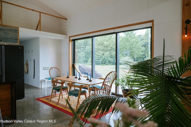 1199 W Highland Rd, Hobart, NY 13788 - dining space featuring finished concrete floors and high vaulted ceiling