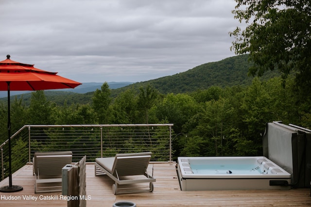 1199 W Highland Rd, Hobart, NY 13788 - deck featuring a wooded view, a covered hot tub, and a mountain view