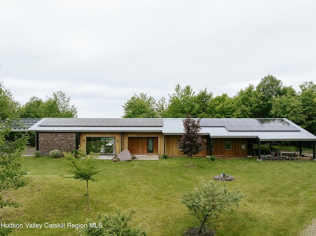 1199 W Highland Rd, Hobart, NY 13788 - view of front of home with roof mounted solar panels and a front lawn