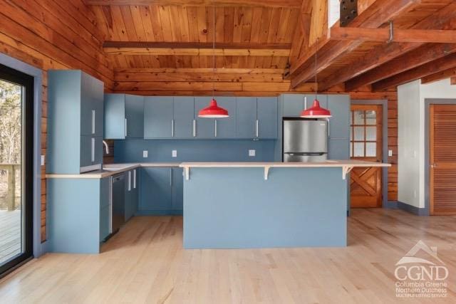 269 Church Ave, Germantown, NY 12526 - kitchen with refrigerator, light countertops, light wood-type flooring, blue cabinets, and wood ceiling