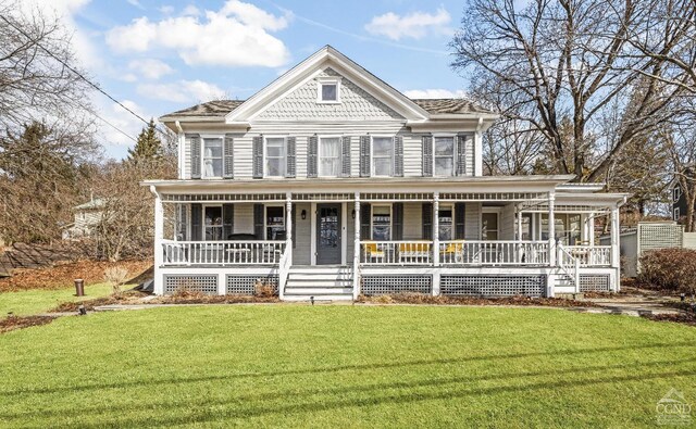 1301 County Route 7, Ancram, NY 12502 - victorian home featuring a front lawn and a porch
