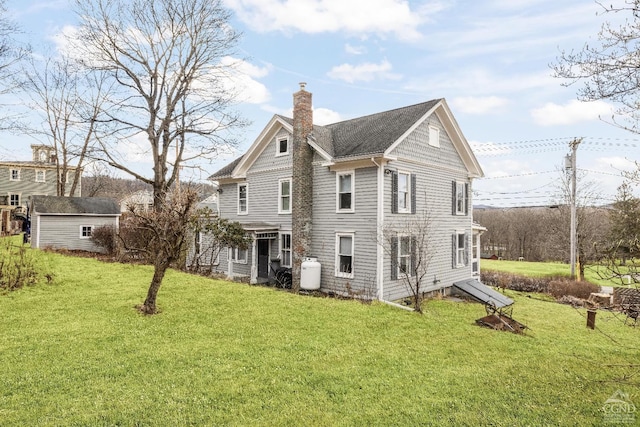 1301 County Route 7, Ancram, NY 12502 - rear view of house featuring a chimney, an outdoor structure, and a yard