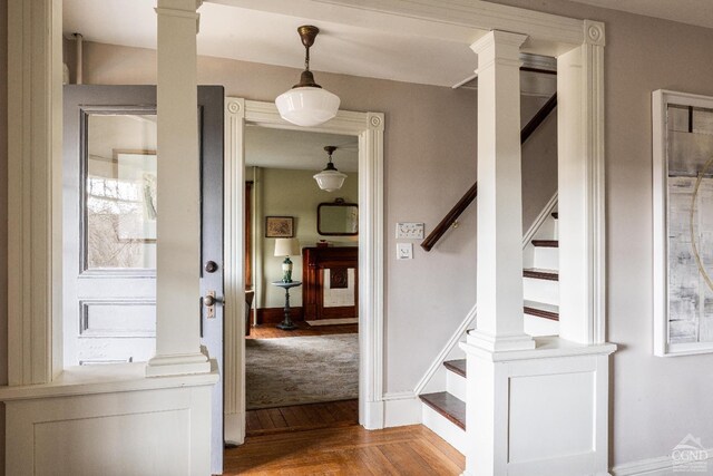 1301 County Route 7, Ancram, NY 12502 - stairs featuring ornate columns, wood finished floors, and baseboards