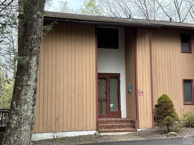 23 Townhouse Ln Unit D 1, Windham, NY 12496 - doorway to property featuring roof with shingles