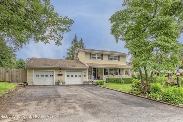 65 Lamb Ave, Saugerties, NY 12477 - traditional-style home with a porch, an attached garage, and driveway