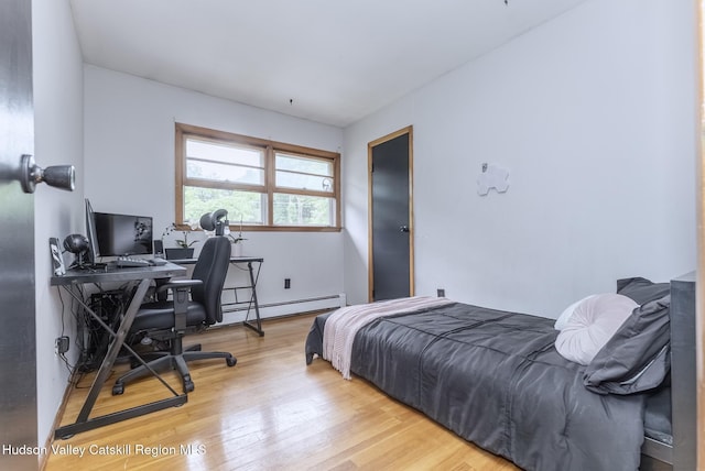 65 Lamb Ave, Saugerties, NY 12477 - bedroom featuring a baseboard radiator, wood finished floors, and a desk