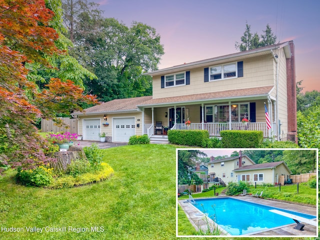 65 Lamb Ave, Saugerties, NY 12477 - view of front of property with a garage, driveway, and covered porch