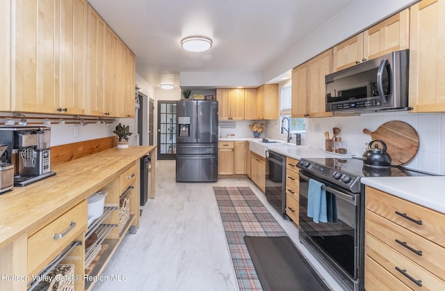 65 Lamb Ave, Saugerties, NY 12477 - kitchen featuring stainless steel appliances, light brown cabinets, butcher block countertops, and backsplash
