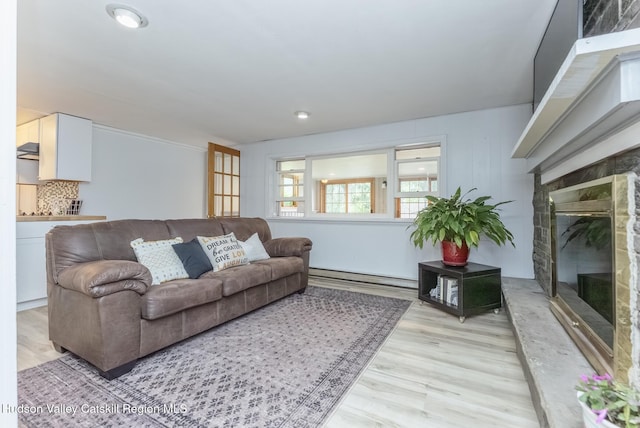 65 Lamb Ave, Saugerties, NY 12477 - living area with a high end fireplace, a baseboard radiator, light wood-type flooring, and recessed lighting