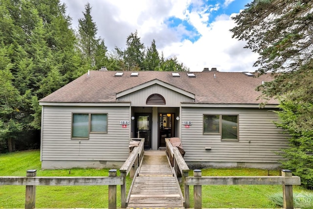91 Windham Ridge Rd Unit 18B, Windham, NY 12496 - view of front of house with roof with shingles, a front yard, crawl space, and a chimney