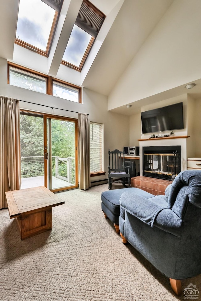 91 Windham Ridge Rd Unit 18B, Windham, NY 12496 - living area with high vaulted ceiling, carpet, a glass covered fireplace, and a skylight