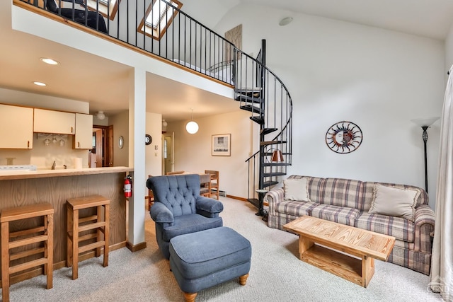 91 Windham Ridge Rd Unit 18B, Windham, NY 12496 - living room featuring high vaulted ceiling, light carpet, stairway, baseboards, and recessed lighting
