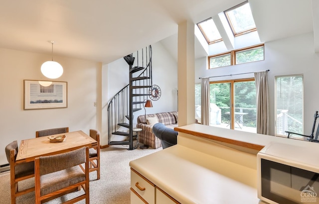 91 Windham Ridge Rd Unit 18B, Windham, NY 12496 - interior space with a skylight, carpet flooring, pendant lighting, light countertops, and high vaulted ceiling
