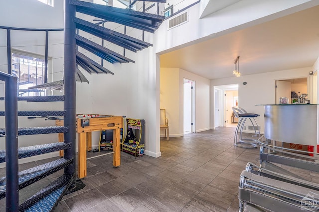 219 Sleepy Hollow Rd, Athens, NY 12015 - stairway featuring a towering ceiling and baseboards