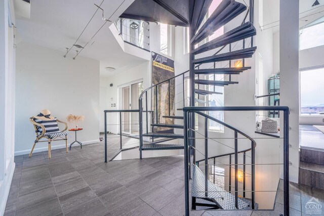 219 Sleepy Hollow Rd, Athens, NY 12015 - staircase featuring a high ceiling and baseboards