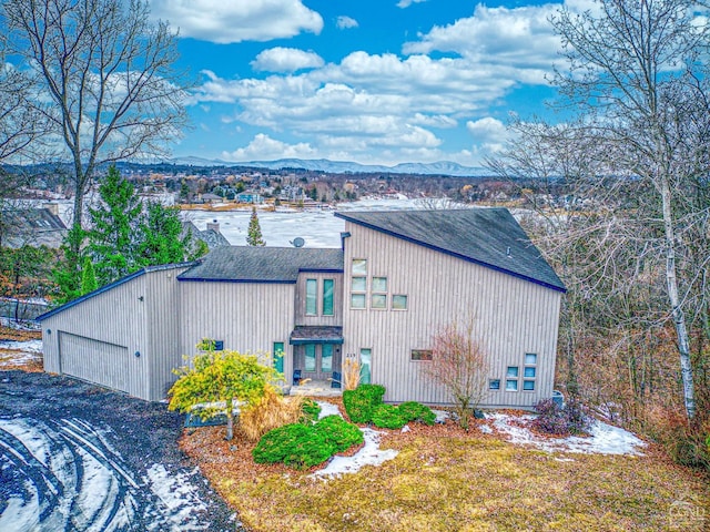 219 Sleepy Hollow Rd, Athens, NY 12015 - view of property exterior featuring a mountain view, a garage, and a shingled roof