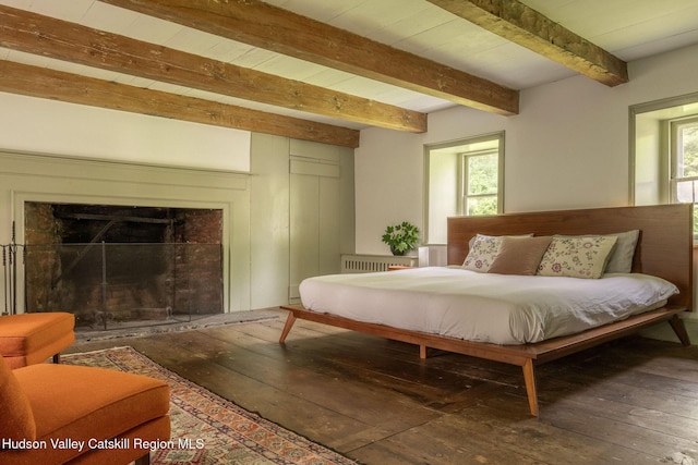 19 Dug Rd, Accord, NY 12404 - bedroom with hardwood / wood-style floors, beam ceiling, radiator heating unit, and a tile fireplace