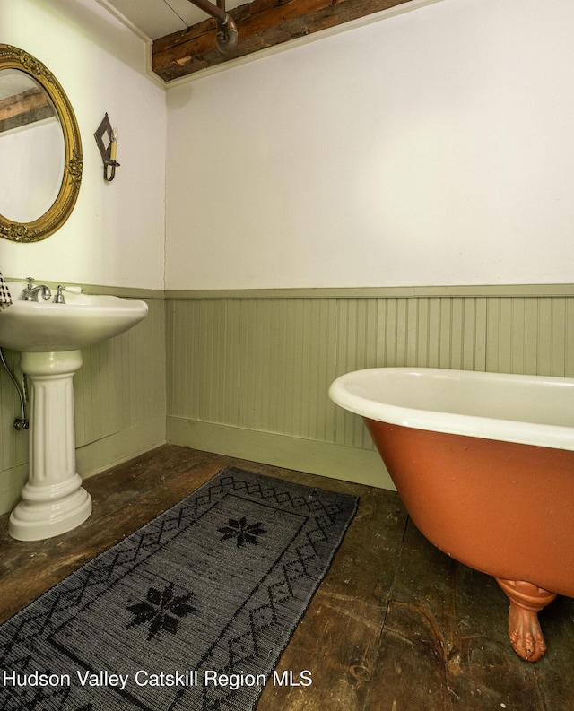 19 Dug Rd, Accord, NY 12404 - bathroom featuring a wainscoted wall and a freestanding tub