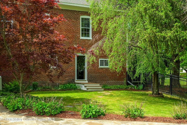 rear view of house with brick siding