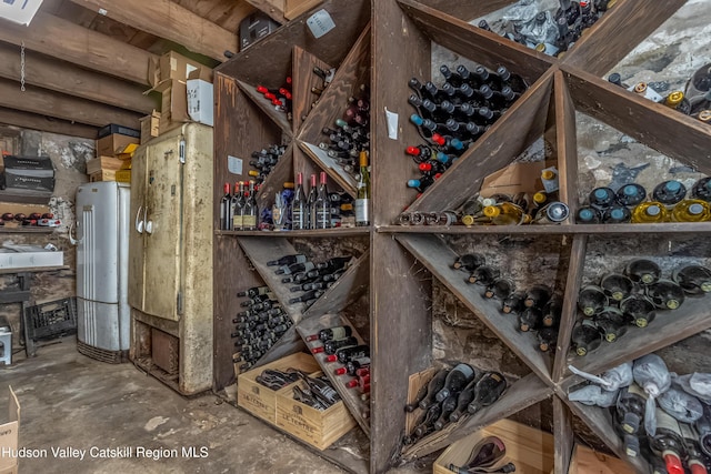 wine cellar featuring concrete floors
