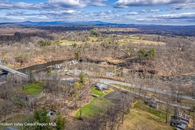 aerial view featuring a water and mountain view