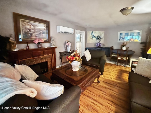 40-67 Popstone Rd, Stone Ridge, NY 12484 - living area with a wall mounted AC, a tile fireplace, and wood finished floors