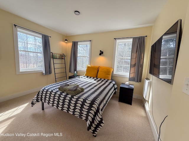 bedroom featuring carpet flooring and baseboards