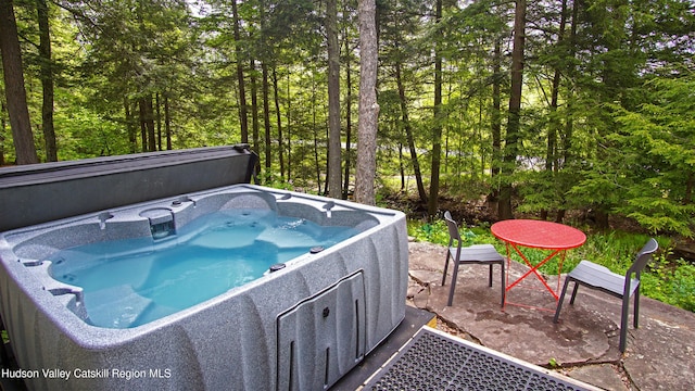 view of pool featuring a hot tub