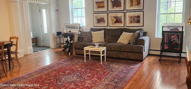 5320 Rte 23, Windham, NY 12496 - living area featuring hardwood / wood-style flooring, plenty of natural light, and a baseboard heating unit