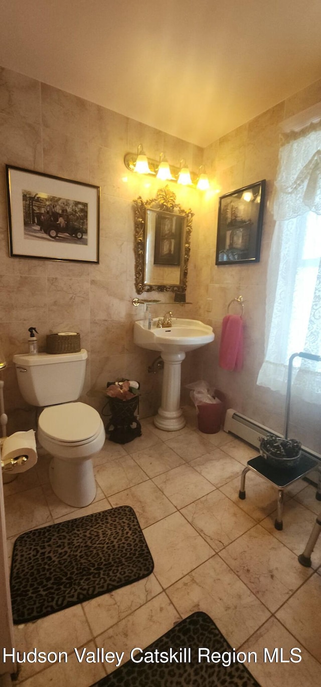 5320 Rte 23, Windham, NY 12496 - bathroom with tile walls, tile patterned floors, and a baseboard heating unit