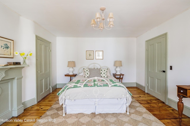 225 Robinson St, Hudson, NY 12534 - bedroom with hardwood / wood-style flooring, a chandelier, and ornamental molding