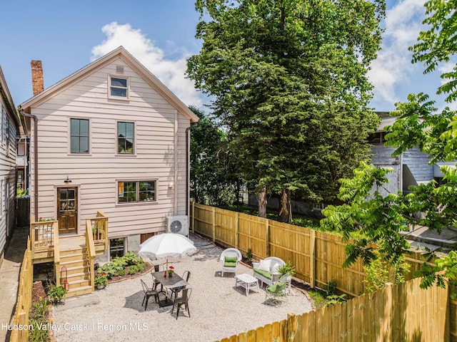225 Robinson St, Hudson, NY 12534 - back of property featuring a fenced backyard and a patio