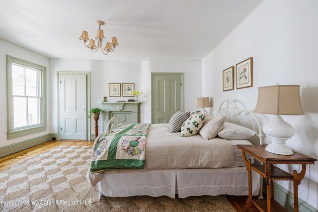 225 Robinson St, Hudson, NY 12534 - bedroom featuring a chandelier and wood finished floors