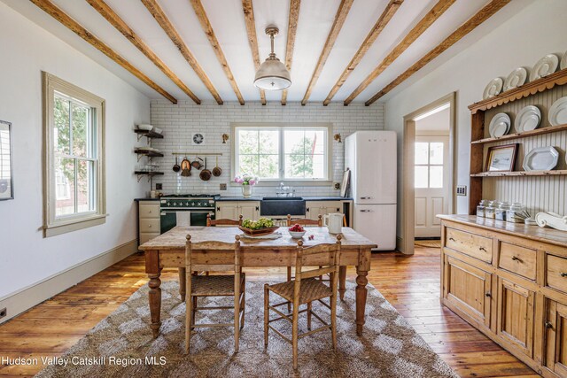 225 Robinson St, Hudson, NY 12534 - dining space with plenty of natural light and light wood-style flooring