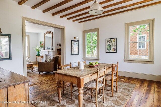 225 Robinson St, Hudson, NY 12534 - dining room with beam ceiling and dark wood finished floors