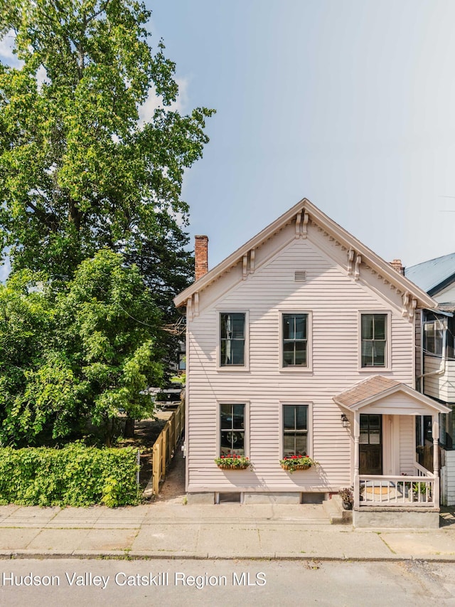 225 Robinson St, Hudson, NY 12534 - view of front of house featuring a chimney
