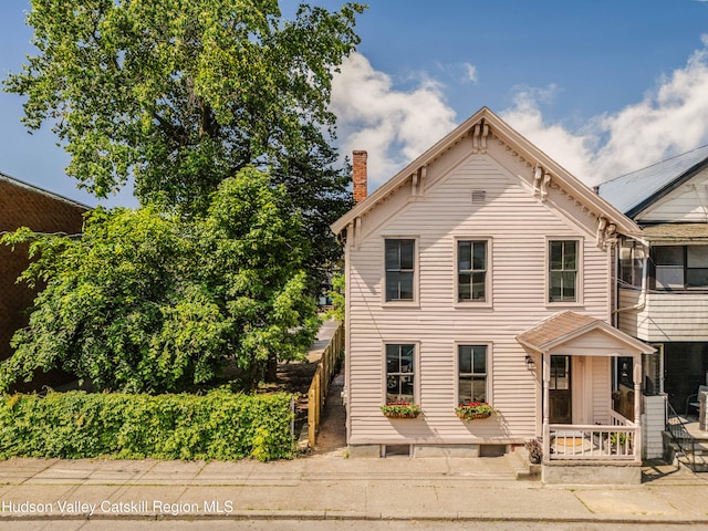 225 Robinson St, Hudson, NY 12534 - italianate home featuring a chimney