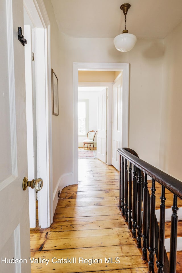 225 Robinson St, Hudson, NY 12534 - hallway with light wood finished floors and an upstairs landing