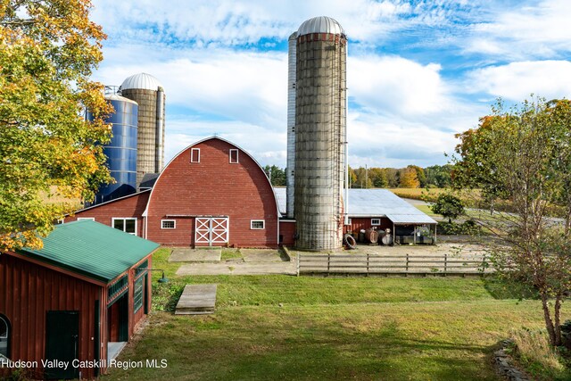 1030 County Route 27a, Ancram, NY 12502 - rear view of house featuring a barn, an outbuilding, and a chimney